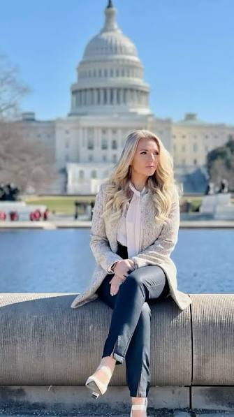 Sarah McAbee, Co-Founder and CEO of Stand in the Gap Foundation, seated in front of the U.S. Capitol